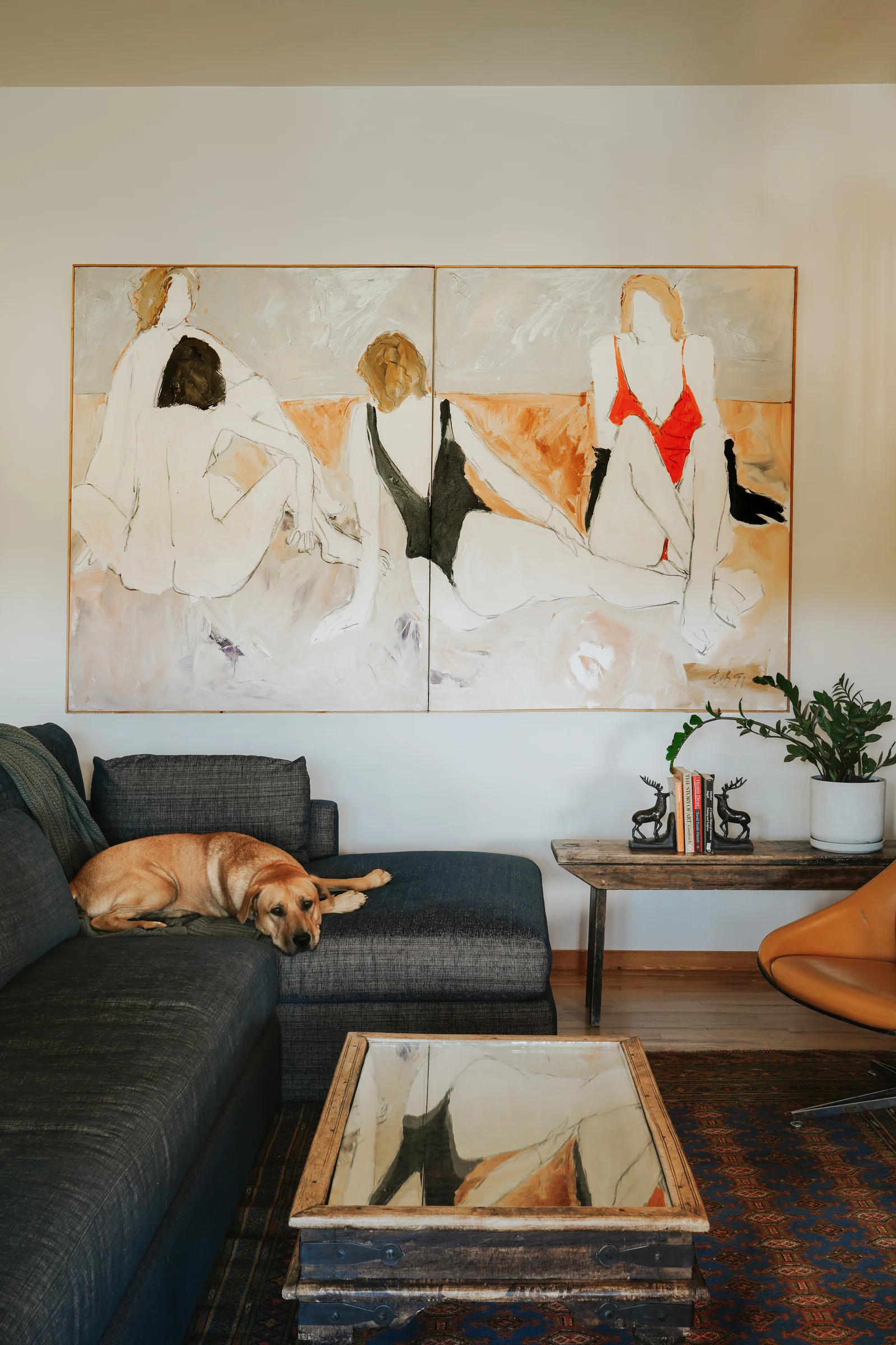 FOUR 1-91 by Freeman W. Butts in a living room, a dog asleep on the sofa below